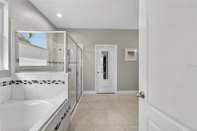 a view of a lake with houses in the back