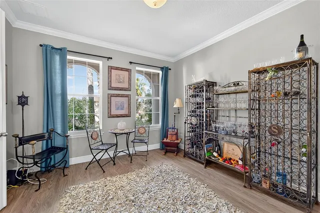 a living room with furniture and white walls