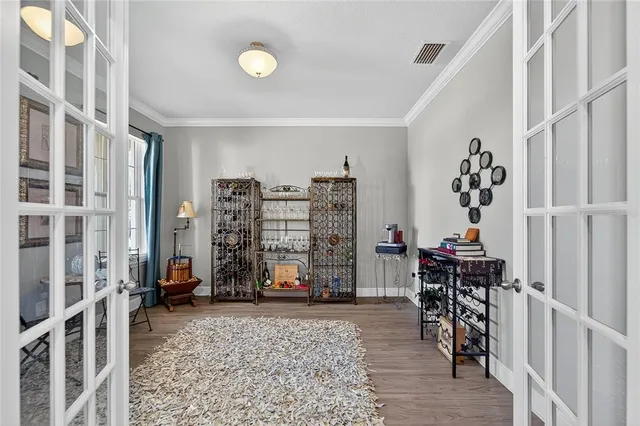 a kitchen with granite countertop a stove a sink a oven and a center island