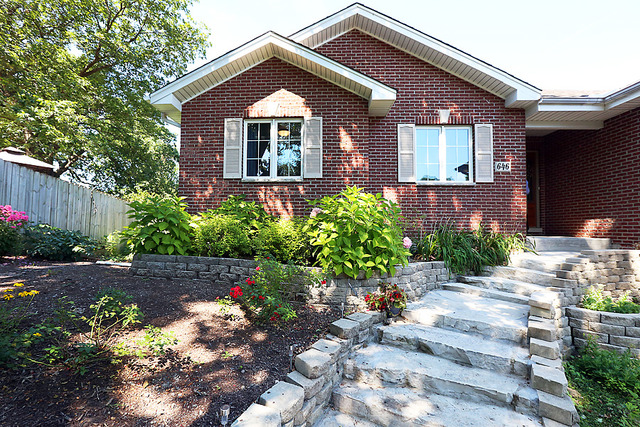646 Robin Ridge Elgin, IL 60123 - Photo 3 of 24 a front view of a house with a yard
