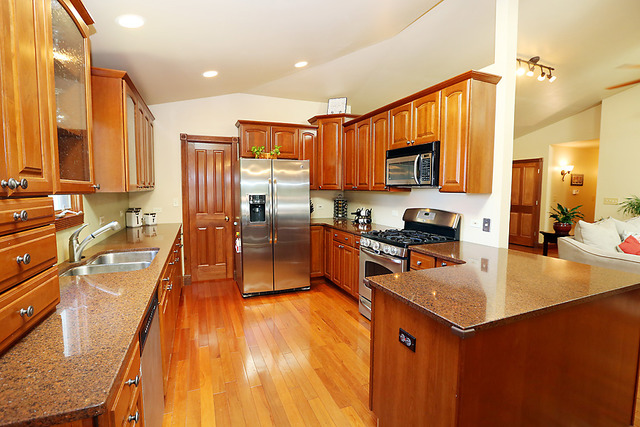 646 Robin Ridge Elgin, IL 60123 - Photo 7 of 24 a kitchen with a sink a counter top space appliances and cabinets