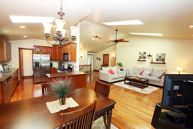 646 Robin Ridge Elgin, IL 60123 - Photo 9 of 24 a living room with furniture kitchen view and a chandelier