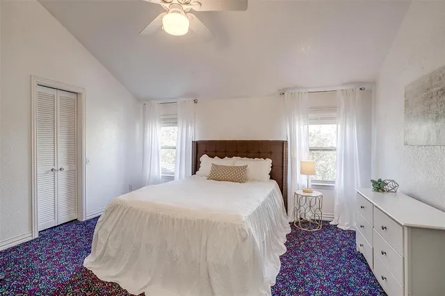 a bed room with a bed and a chandelier