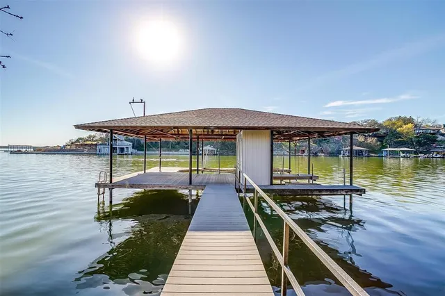 a swimming pool view with a seating space