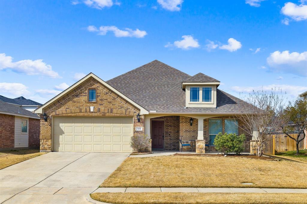 front view of a house with a dry yard
