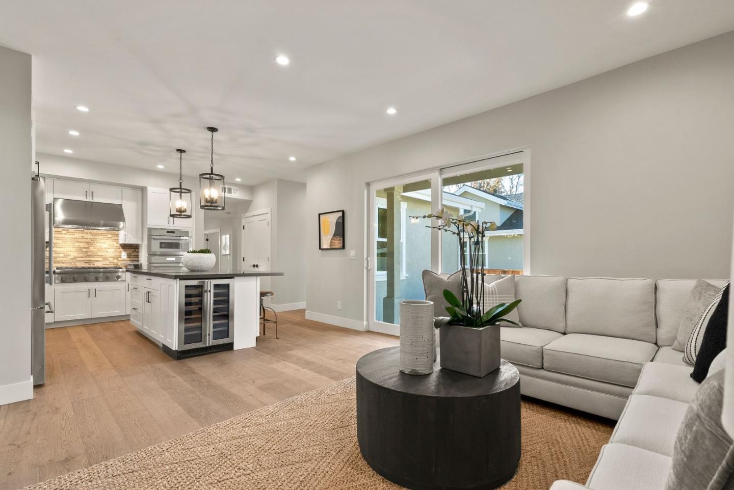 275 Willow Road Menlo Park, CA 94025 - Photo 15 of 40 a living room with furniture kitchen view and a large window