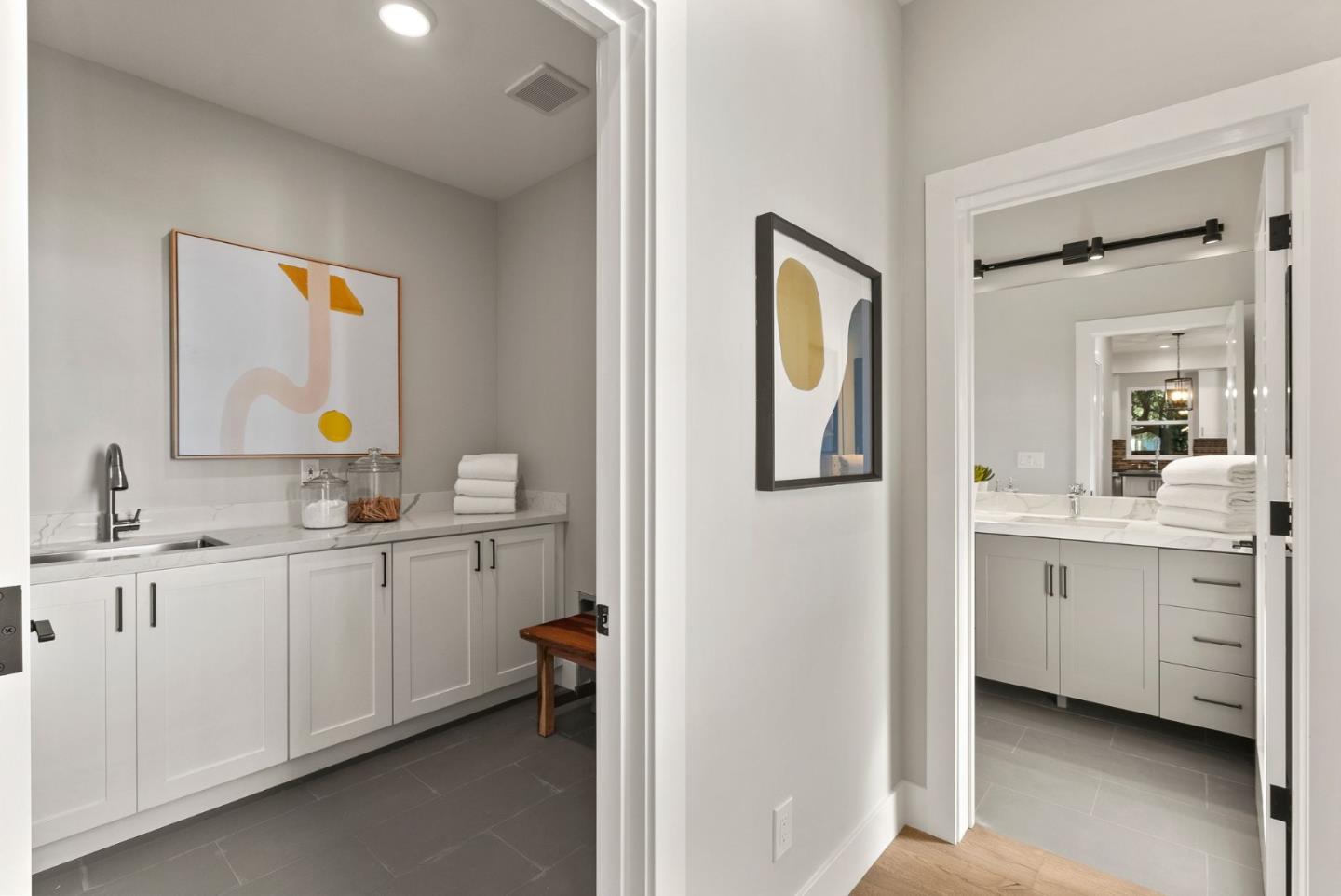 275 Willow Road Menlo Park, CA 94025 - Photo 18 of 40 a spacious bathroom with a double vanity sink and a mirror