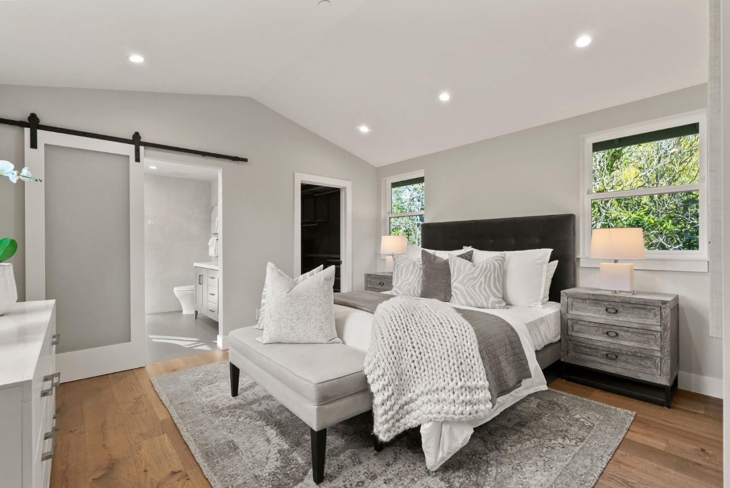 275 Willow Road Menlo Park, CA 94025 - Photo 20 of 40 a spacious bedroom with a bed and a couch