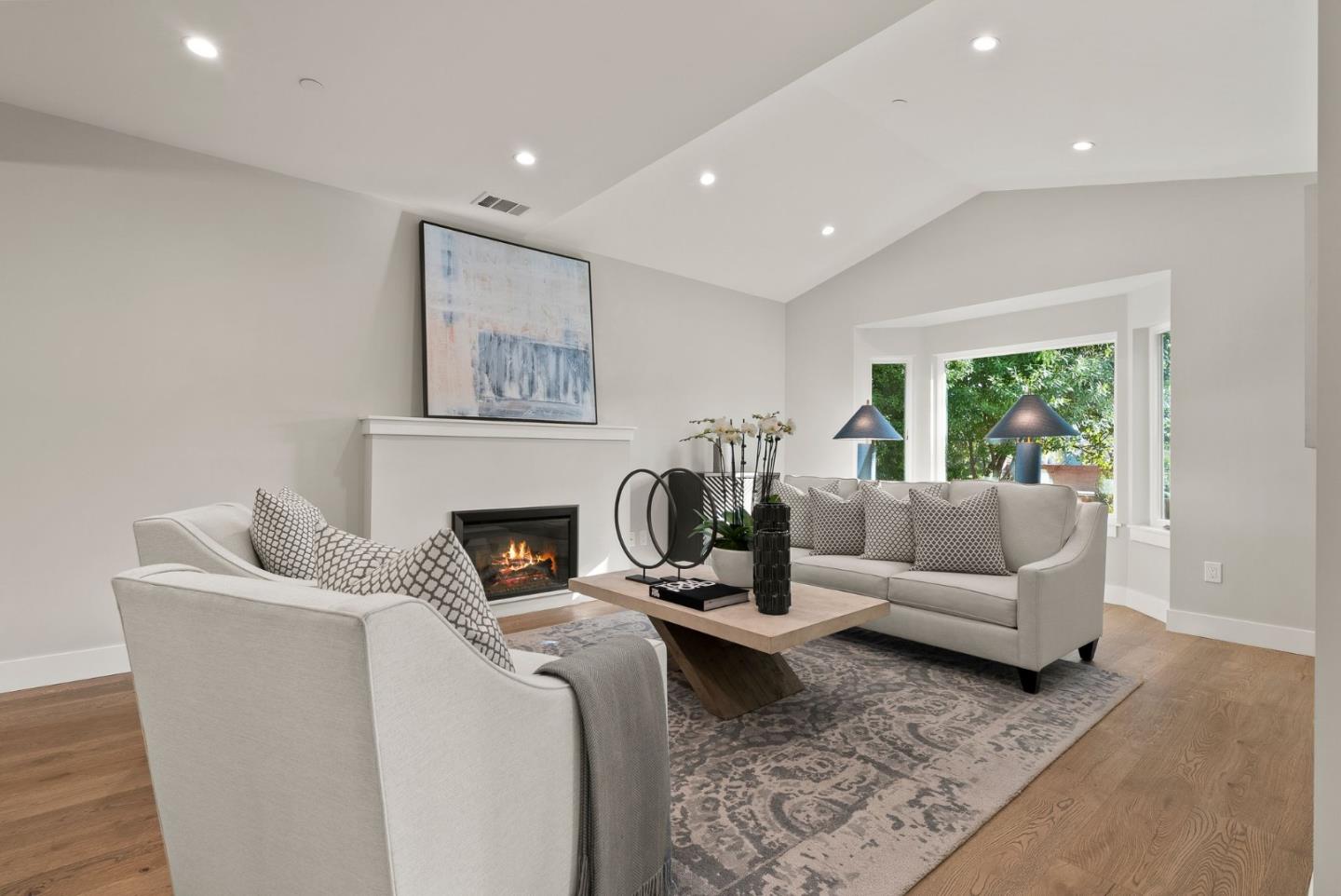 275 Willow Road Menlo Park, CA 94025 - Photo 2 of 40 a living room with furniture and a fireplace