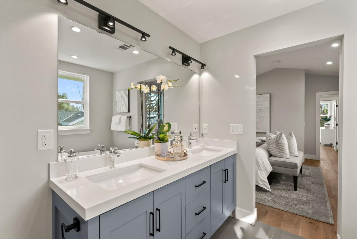 275 Willow Road Menlo Park, CA 94025 - Photo 23 of 40 a spacious bathroom with a double vanity sink and a mirror