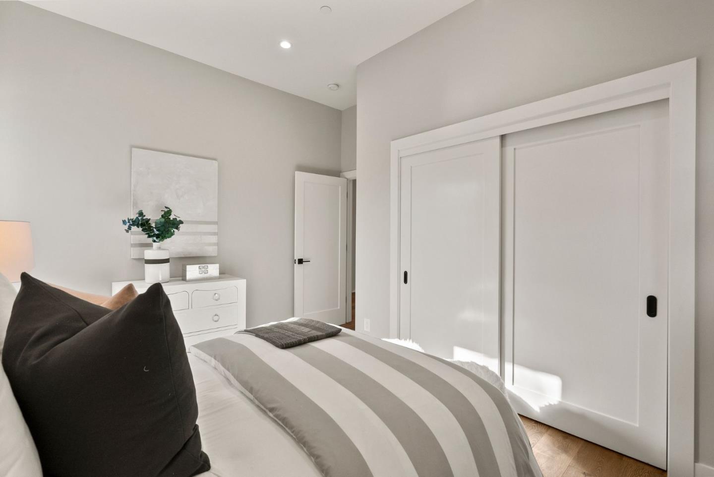 275 Willow Road Menlo Park, CA 94025 - Photo 28 of 40 a bedroom with a bed and a potted plant