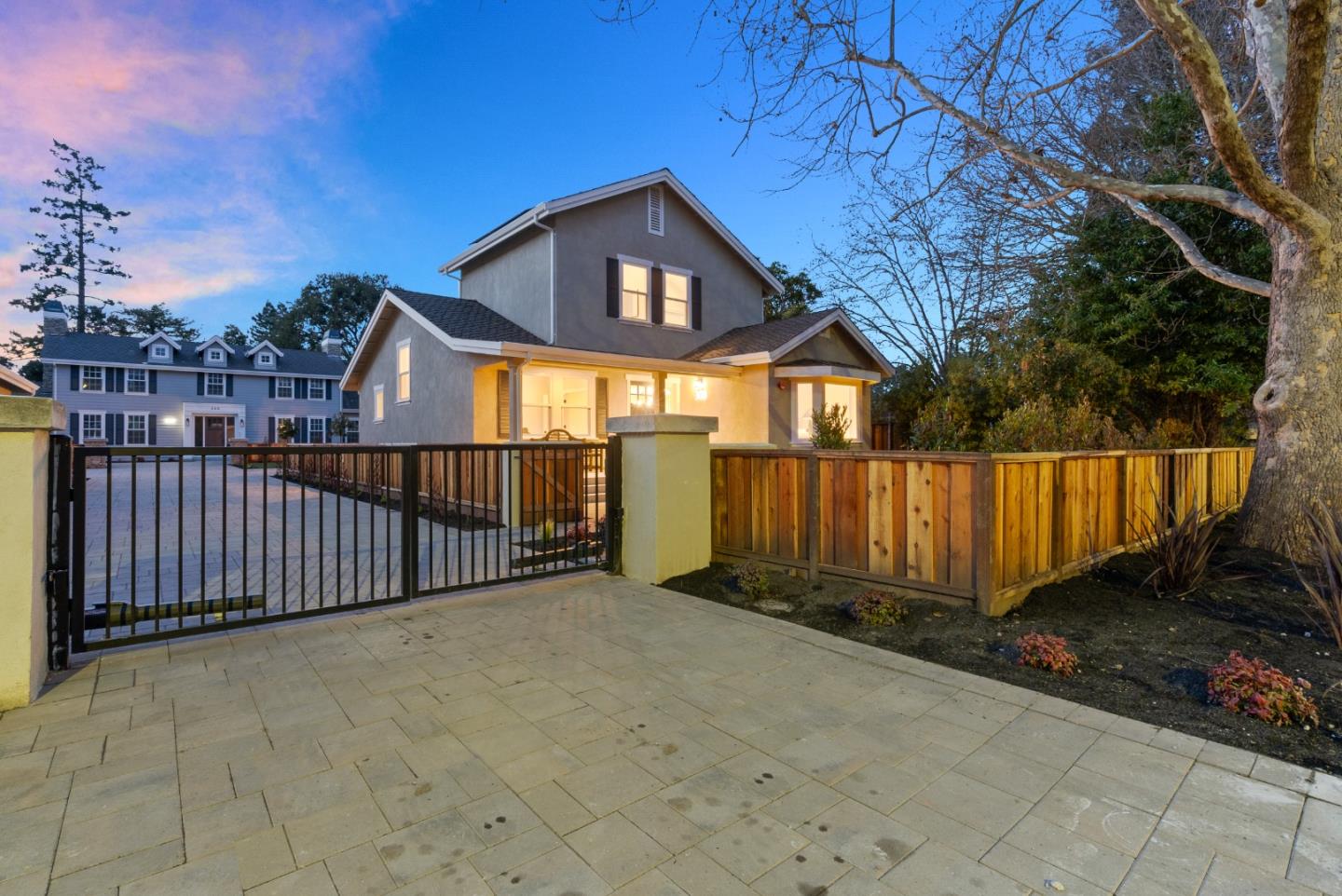 275 Willow Road Menlo Park, CA 94025 - Photo 37 of 40 a view of a house with wooden fence next to a yard