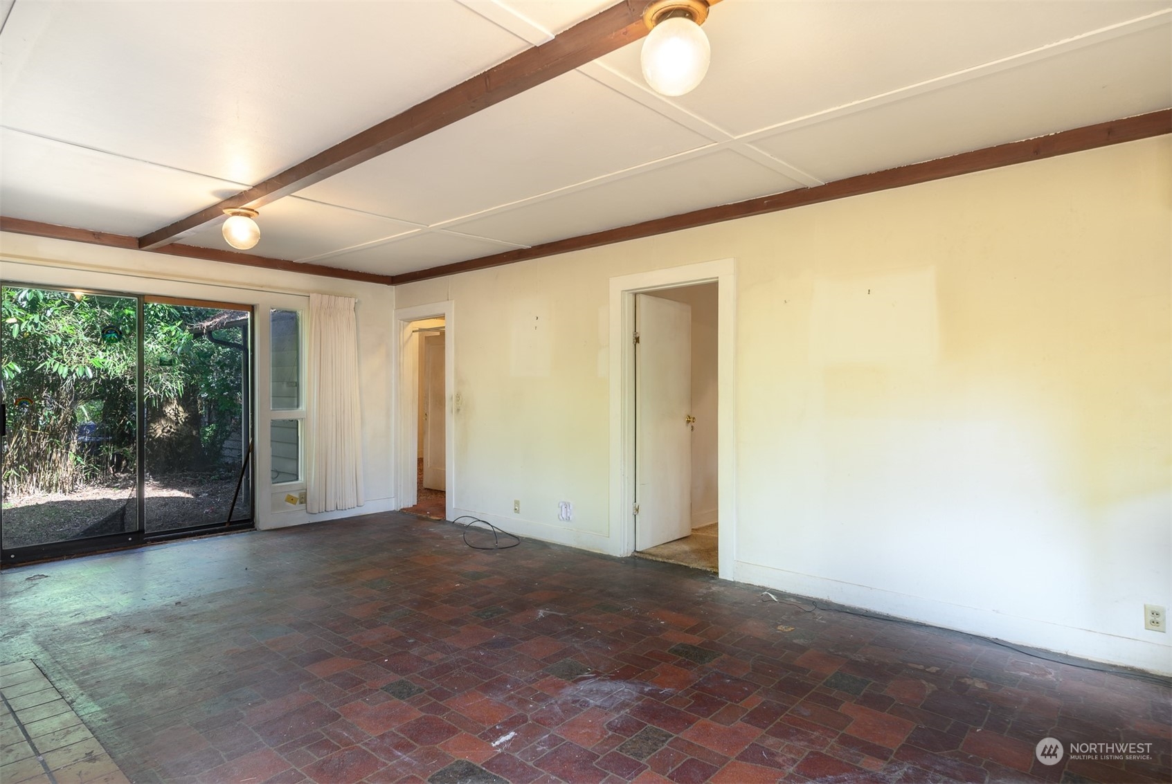 209 Southwest 132nd Street Burien, WA 98146 - Photo 12 of 27 a view of empty room with window and hardwood