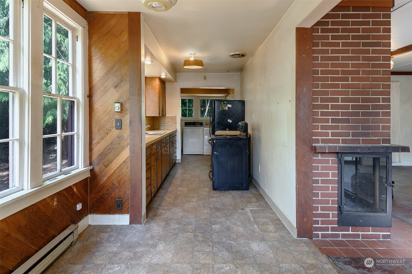 209 Southwest 132nd Street Burien, WA 98146 - Photo 14 of 27 a view of entryway with a window and a kitchen view
