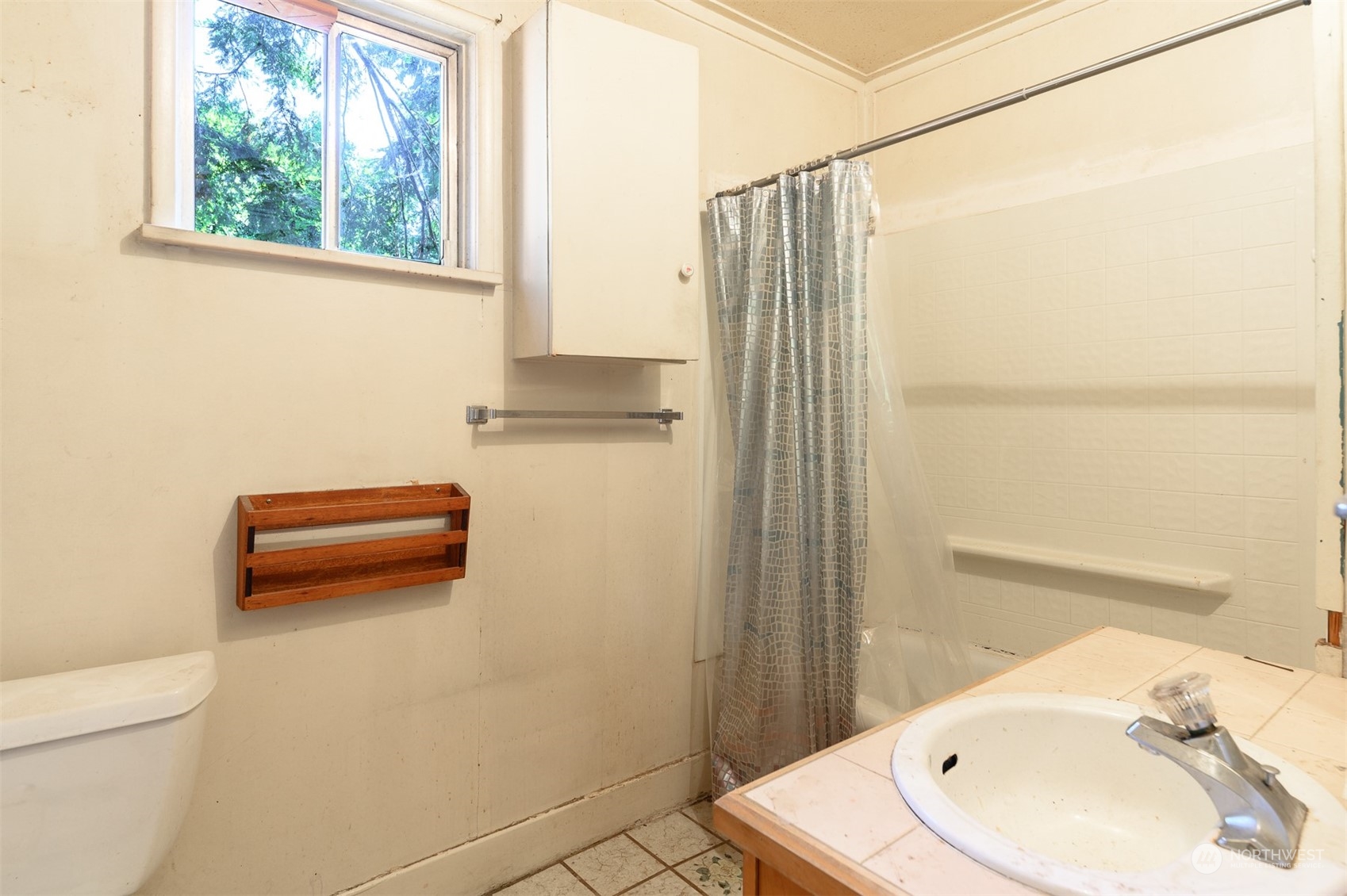 209 Southwest 132nd Street Burien, WA 98146 - Photo 20 of 27 a bathroom with a sink and a shower
