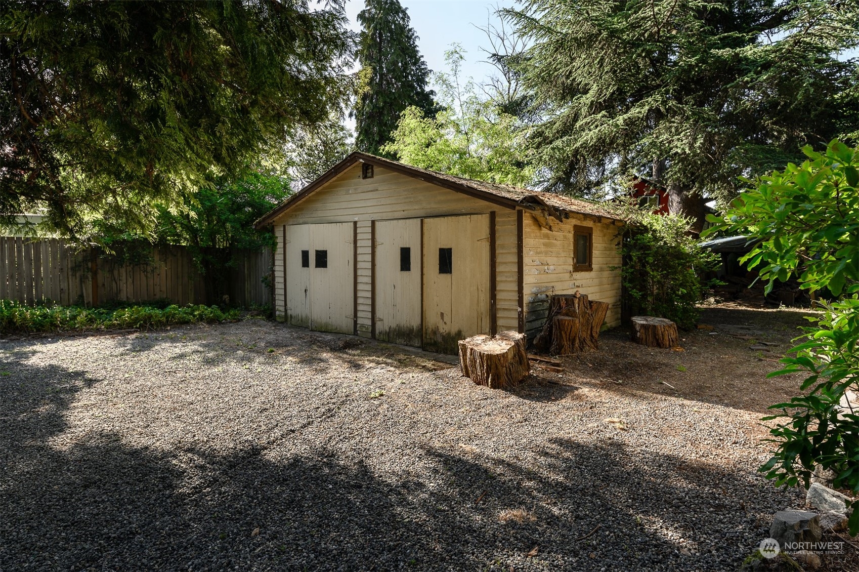 209 Southwest 132nd Street Burien, WA 98146 - Photo 5 of 27 a backyard of a house with table and chairs