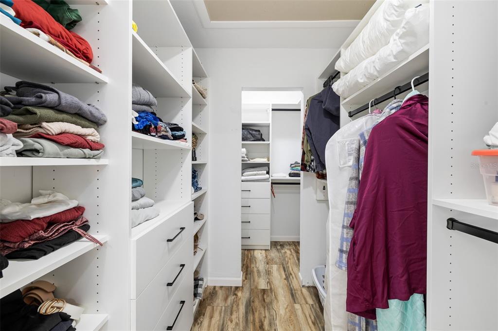 11311 Northeast 40th Street Road Silver Springs, FL 34488 - Photo 32 of 67 a view of walk in closet with clothes and shoes