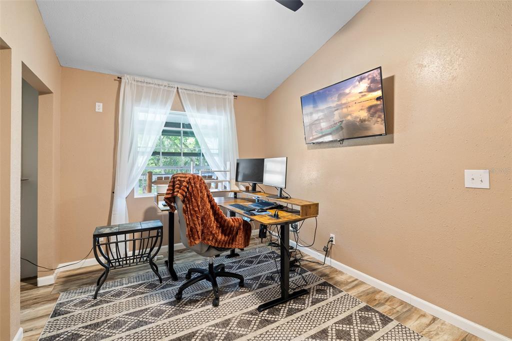 11311 Northeast 40th Street Road Silver Springs, FL 34488 - Photo 36 of 67 a workspace with furniture and a window