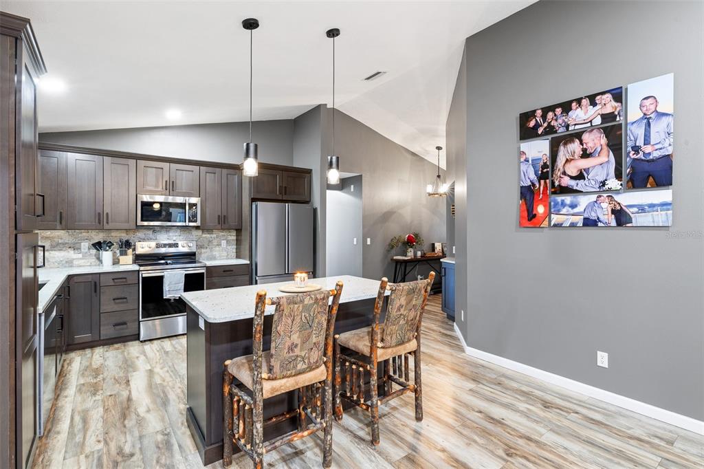 11311 Northeast 40th Street Road Silver Springs, FL 34488 - Photo 10 of 67 a view of a dining room with furniture