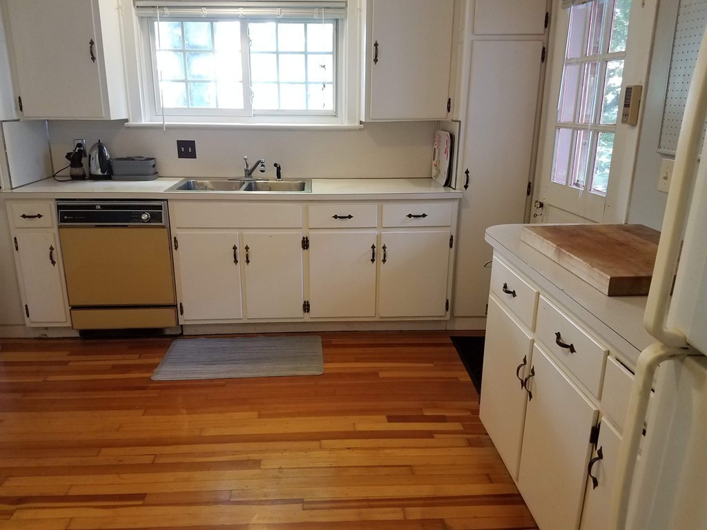 80 Eleanor Road Springfield, MA 01108 - Photo 11 of 30 a kitchen with a sink stove and cabinets