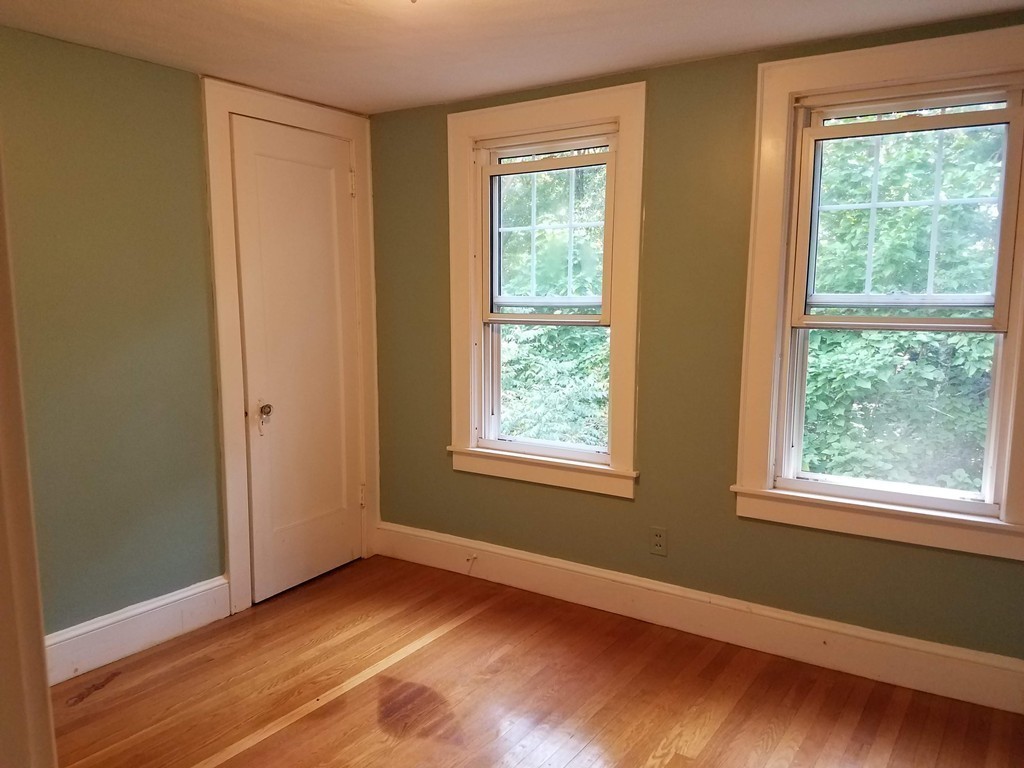 80 Eleanor Road Springfield, MA 01108 - Photo 18 of 30 a view of an empty room with wooden floor and a window