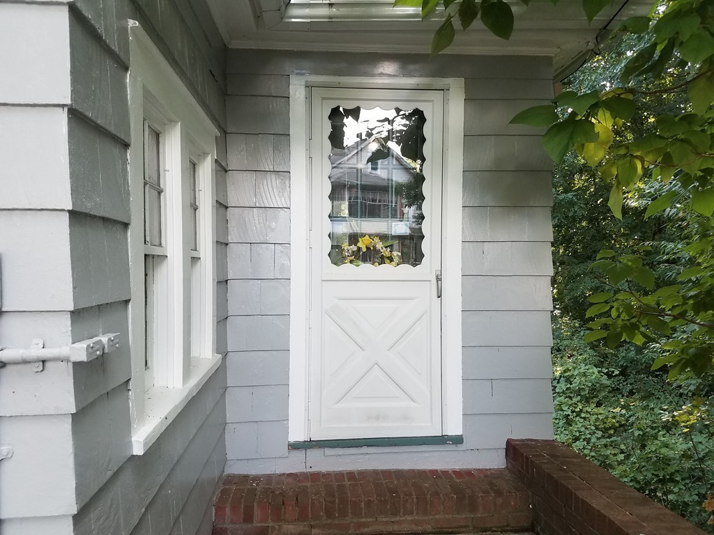 80 Eleanor Road Springfield, MA 01108 - Photo 2 of 30 a view of a door of the house and window