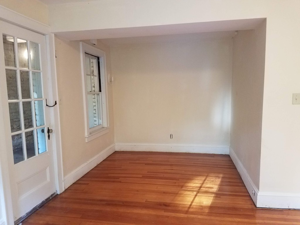 80 Eleanor Road Springfield, MA 01108 - Photo 23 of 30 a view of an empty room with wooden floor and a window