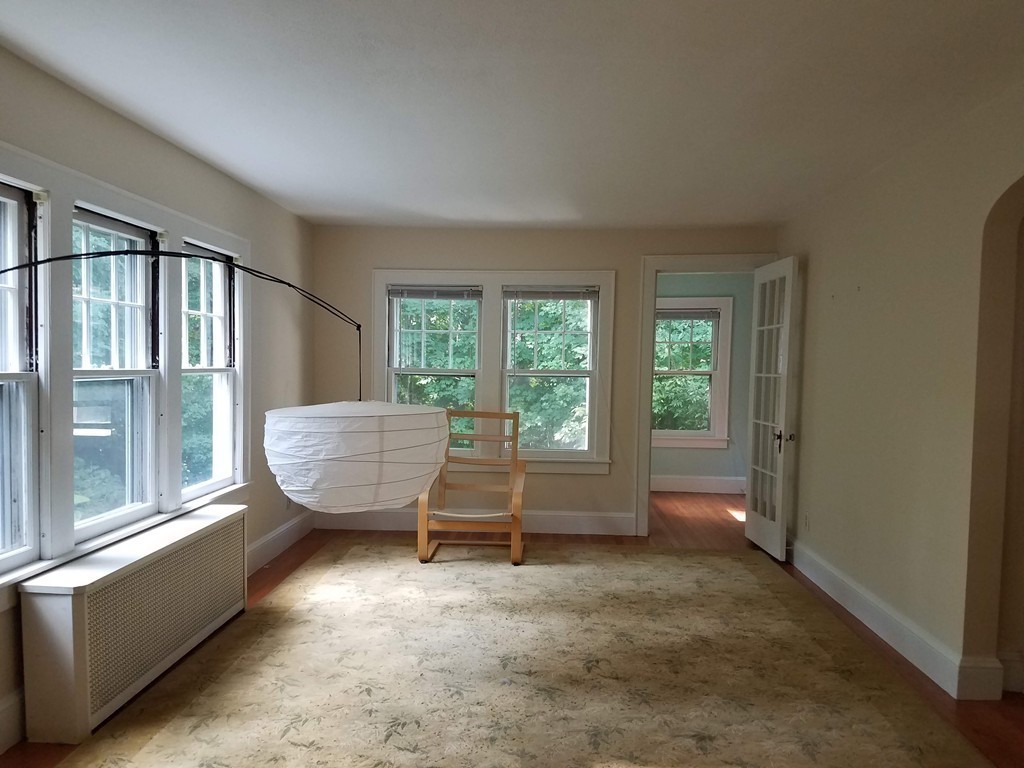 80 Eleanor Road Springfield, MA 01108 - Photo 6 of 30 a view of an empty room with wooden floor and a window