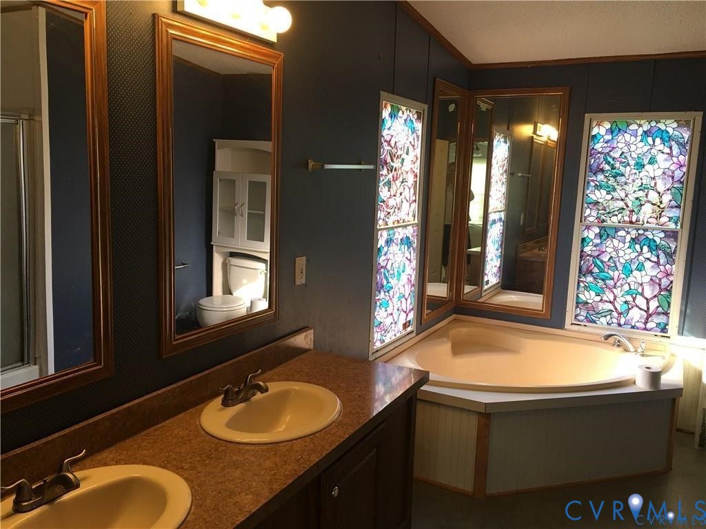 12232 Darbys Road Doswell, VA 23047 - Photo 11 of 17 Full bathroom with a garden tub and double vanity
