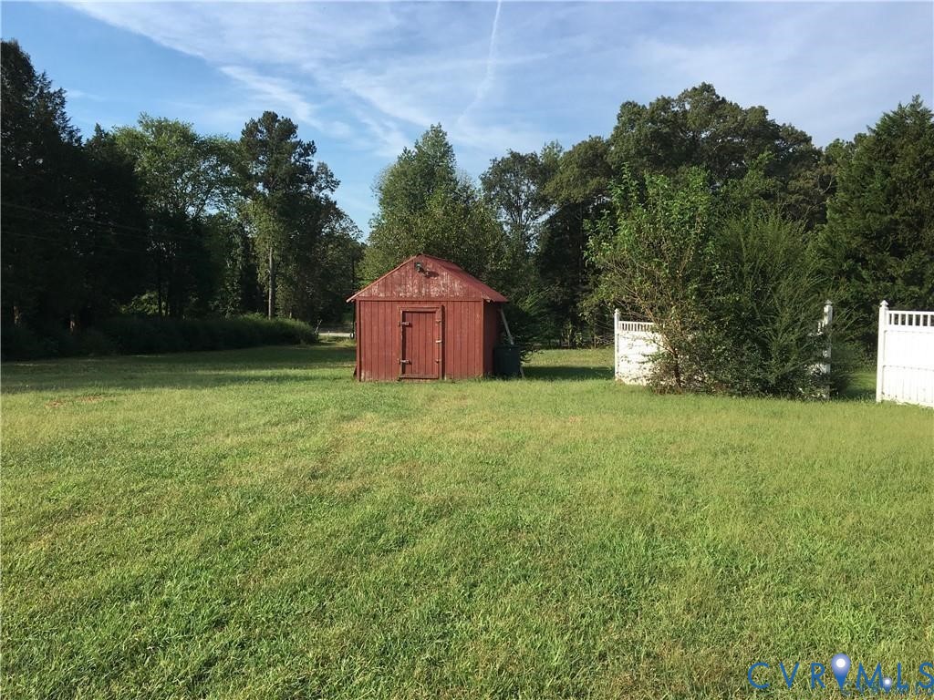 12232 Darbys Road Doswell, VA 23047 - Photo 3 of 17 View of yard with a storage shed