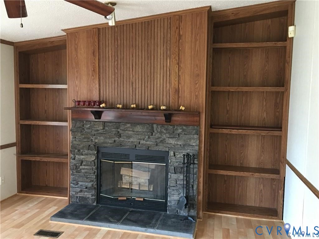 12232 Darbys Road Doswell, VA 23047 - Photo 5 of 17 Detailed view of wood finished floors, ceiling fan