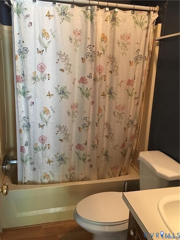 12232 Darbys Road Doswell, VA 23047 - Photo 6 of 17 Bathroom with shower / bath combo, vanity, and woo