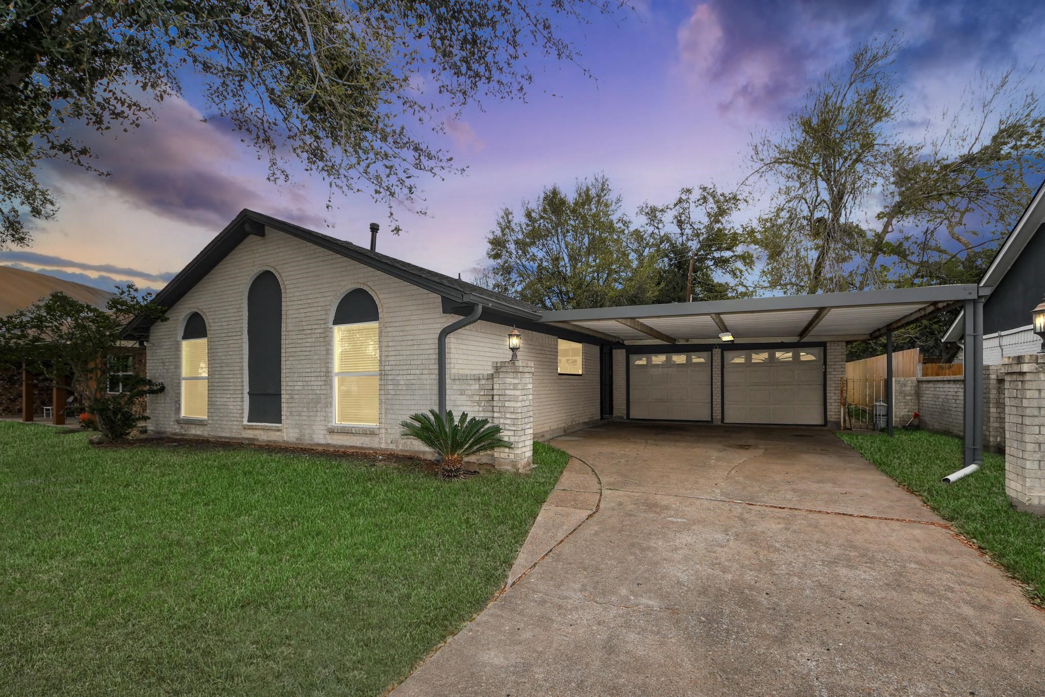 1415 Parry-Sound Pasadena, TX 77504 - Photo 1 of 34 a front view of a house with a yard and garage