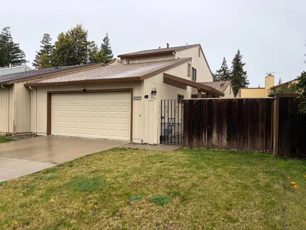 a front view of a house with garage