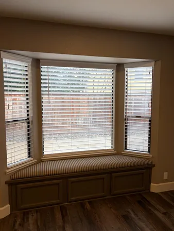 a kitchen with a sink stove top oven and cabinets