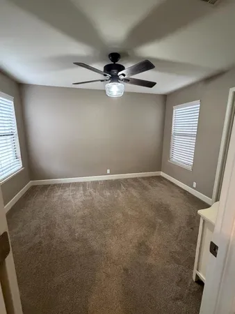 a bathroom with a sink and mirror with toilet