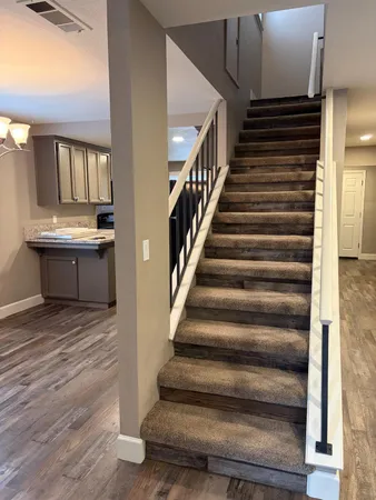 a view of a balcony with wooden floor