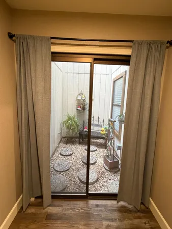a view of a door and chair in a room