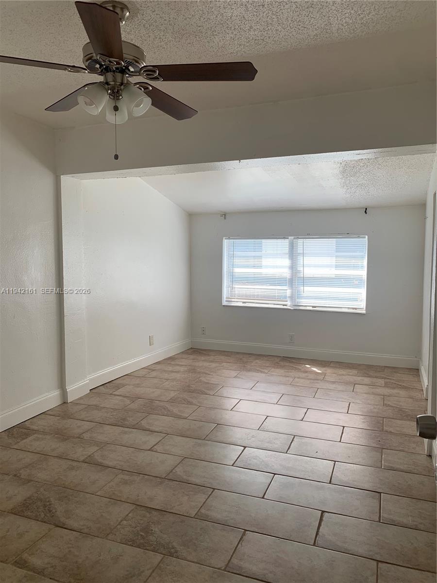 4501 Southwest 25th Street West Park, FL 33023 - Photo 16 of 17 a view of an empty room with a window