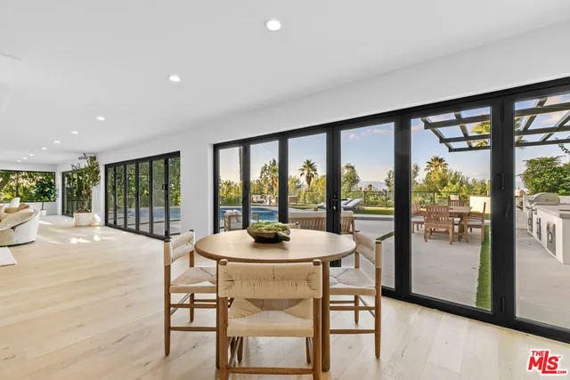 a spacious bedroom with a large bed and a large window