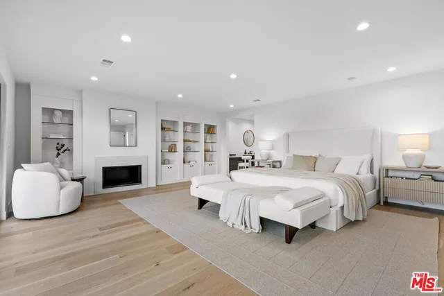 a bedroom with a bed and a couch