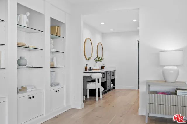 an empty room with large windows and a yard