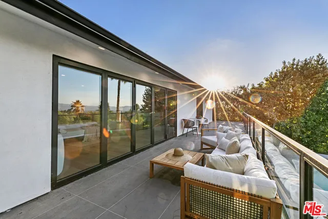 a view of a terrace with sitting area