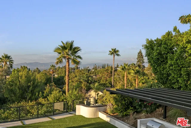 an aerial view of a house with outdoor space garden view and trees