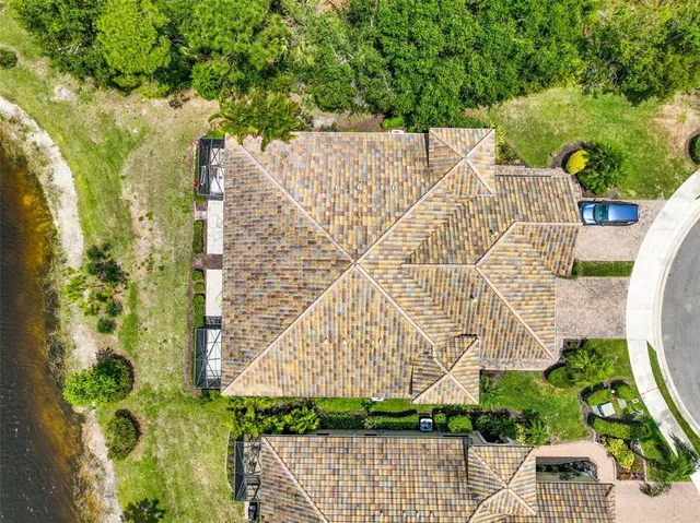 an aerial view of multiple houses with a yard