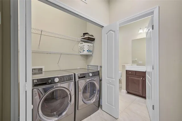 a kitchen with cabinets and chairs
