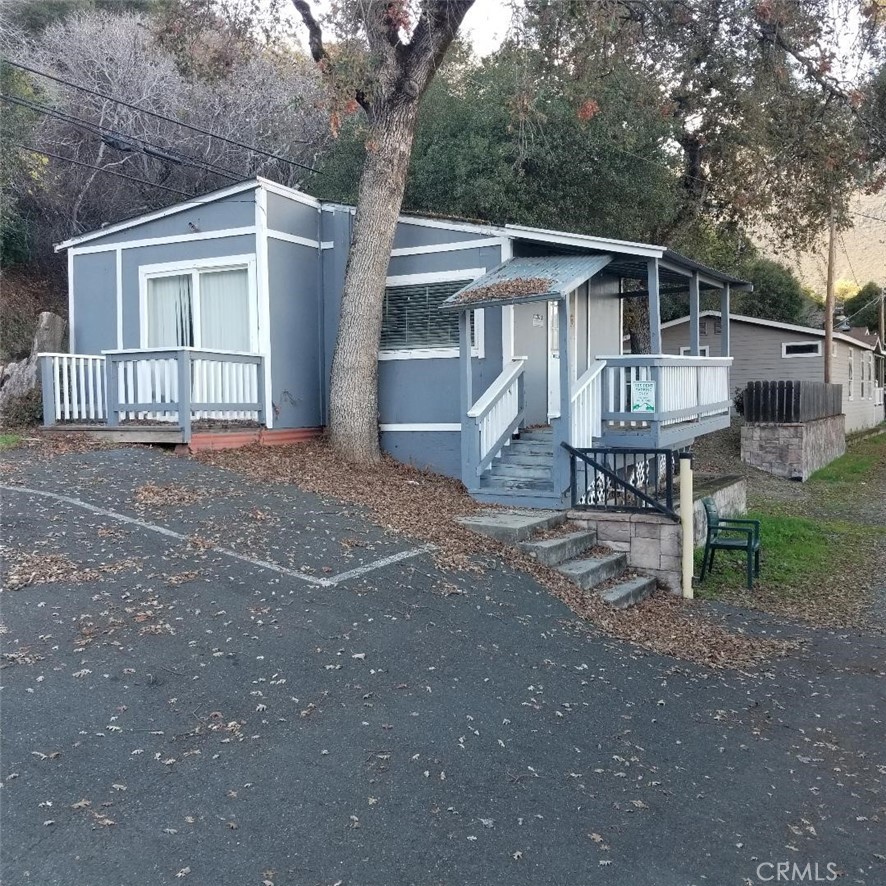 9435 Konocti Bay Road Kelseyville, CA 95451 - Photo 5 of 12 a view of a house with a yard and wooden fence