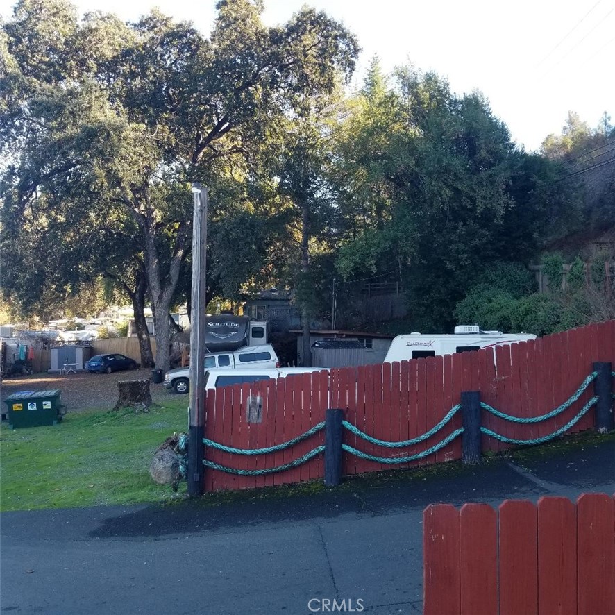 9435 Konocti Bay Road Kelseyville, CA 95451 - Photo 8 of 12 an outdoor sitting area with couch and large trees
