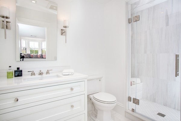 89 Beacon Street, Unit PH Boston, MA 02108 - Photo 12 of 22 a bathroom with a sink a toilet and shower