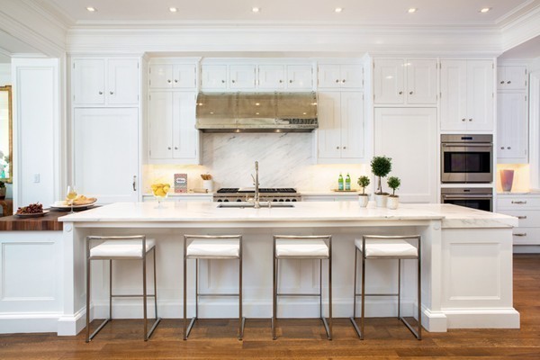 89 Beacon Street, Unit PH Boston, MA 02108 - Photo 7 of 22 a kitchen with stainless steel appliances granite countertop a stove and white cabinets